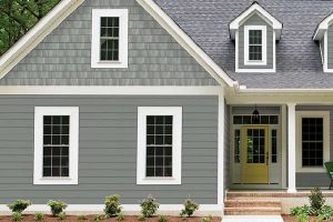 sscend siding with white window trims and shake installed on gable