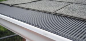 Close-up of roof gutter guard installation