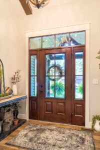 Elegant wooden front door with natural decor.