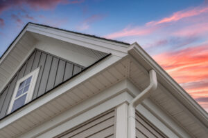 House roof and gutter at sunset