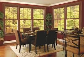 Dining room with large windows and plants