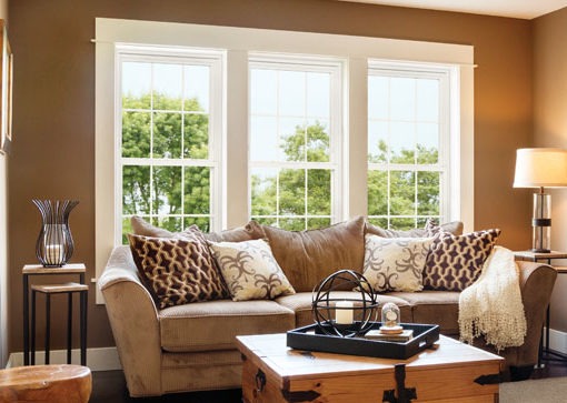 Cozy living room with beige sofa and decor.