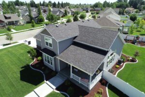 Aerial view of suburban neighborhood with landscaped lawns.