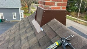 Roof chimney with brown flashing installation process.