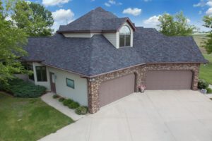 Grey roof house with garage and driveway