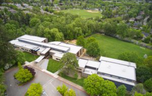 Aerial view of school building and sports fields.