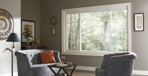 Cozy living room with large window and sofas.