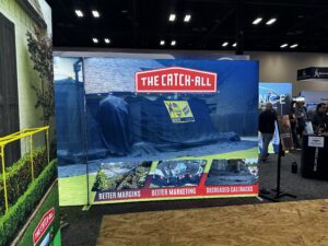 Exhibit booth promoting roofing marketing solutions.