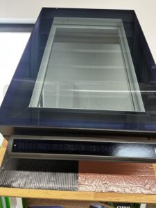 Skylight window with solar panel attachment