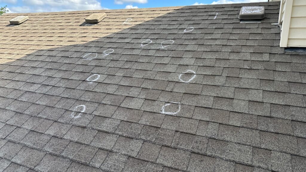 Roof with chalk circles indicating hail damage