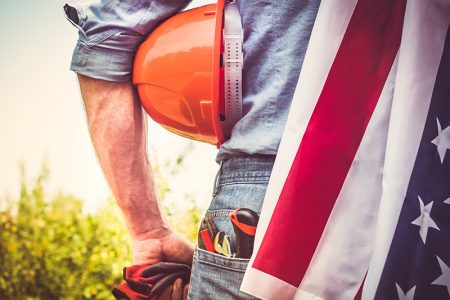 Construction worker with US flag