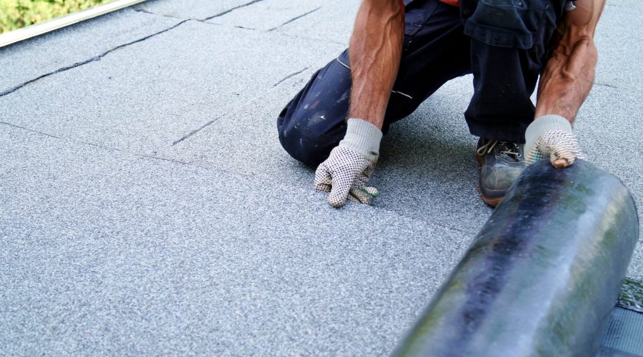 Worker, Installing Flat Roofing Material