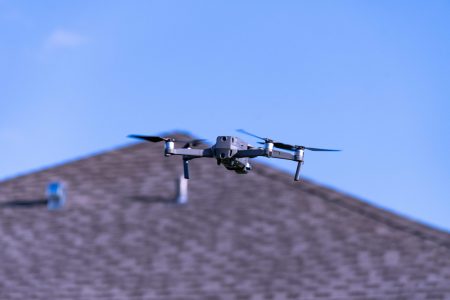 Camera,Drone,Hovering,Near,Neighborhood,House