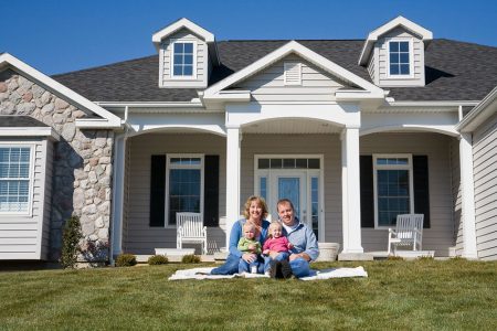 family-photo-outside-their-home