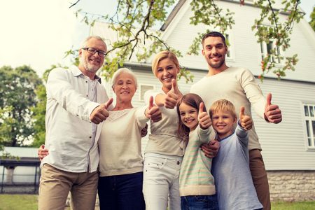 happy-family-with-approved-signed-outside-the-houe