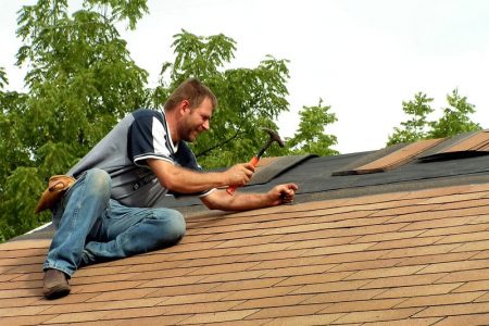 man-fixing-roof