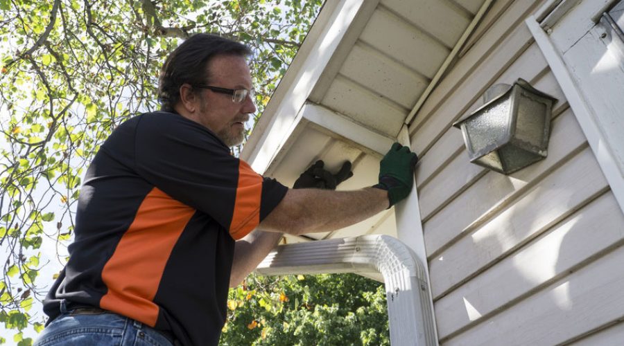 man-fixing-the-house-siding