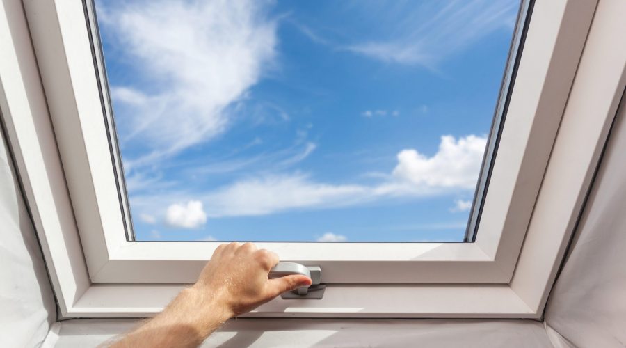 Man,Close,New,Skylight,(mansard,Window),In,An,Attic,Room