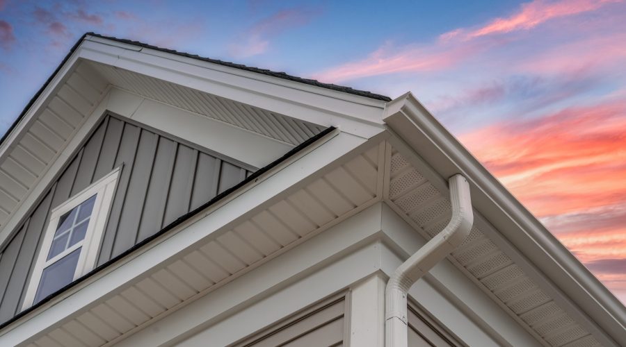 House roof and gutter at sunset